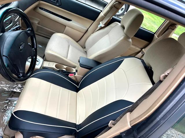 Photo of 2003 Woodland Green Pearl/Textured Gray Subaru Forester