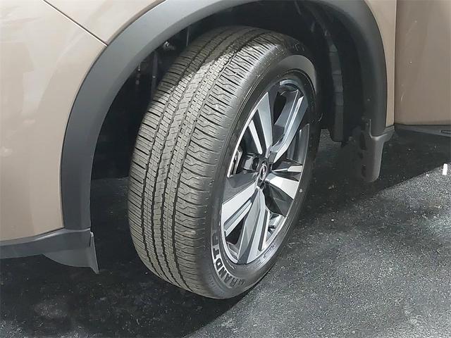 Photo of 2024 Baja Storm Metallic/Super Black Nissan Rogue
