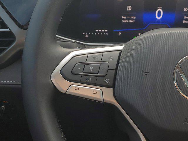 Photo of 2025 Bright Moss Green Metallic/Deep Black Roof Volkswagen Taos