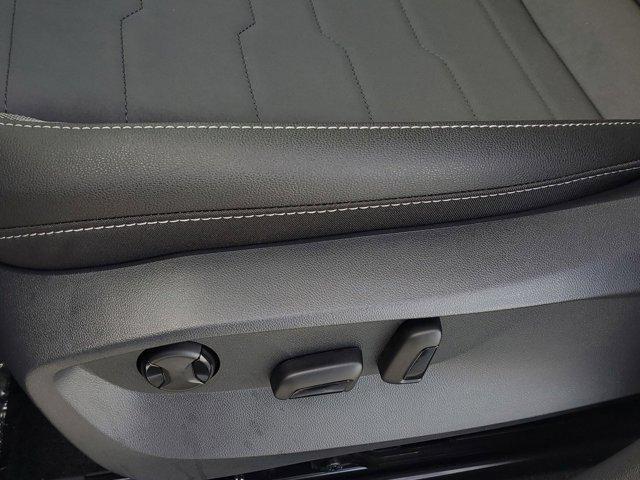 Photo of 2025 Bright Moss Green Metallic/Deep Black Roof Volkswagen Taos