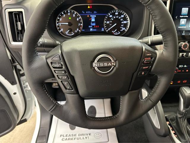 Photo of 2025 Glacier White Nissan Frontier