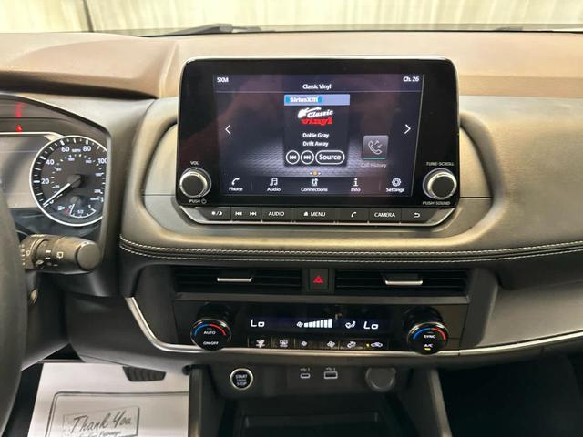 Photo of 2023 Pearl White Tri-Coat Nissan Rogue