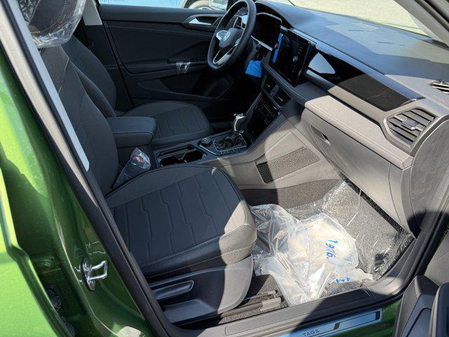 Photo of 2025 Bright Moss Green Metallic/Deep Black Roof Volkswagen Taos