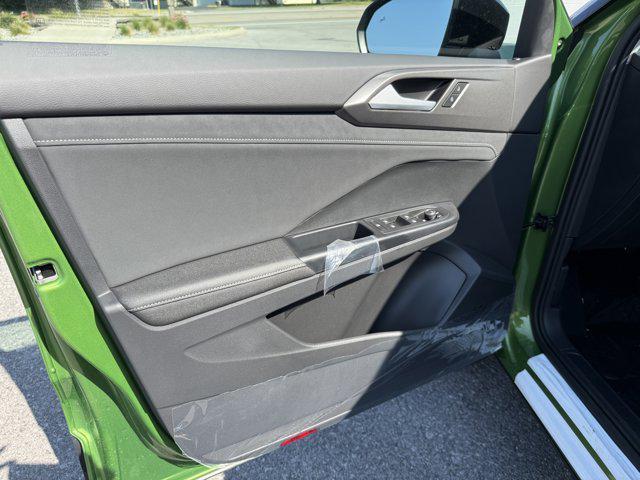 Photo of 2025 Bright Moss Green Metallic/Deep Black Roof Volkswagen Taos