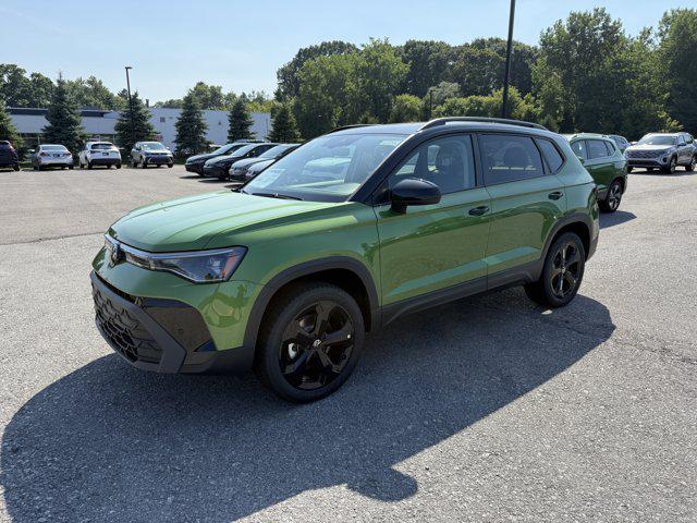 Photo of 2025 Bright Moss Green Metallic/Deep Black Roof Volkswagen Taos