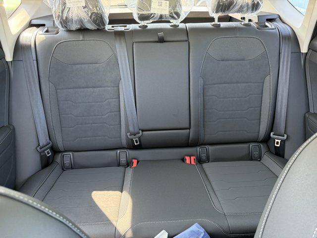 Photo of 2025 Bright Moss Green Metallic/Deep Black Roof Volkswagen Taos