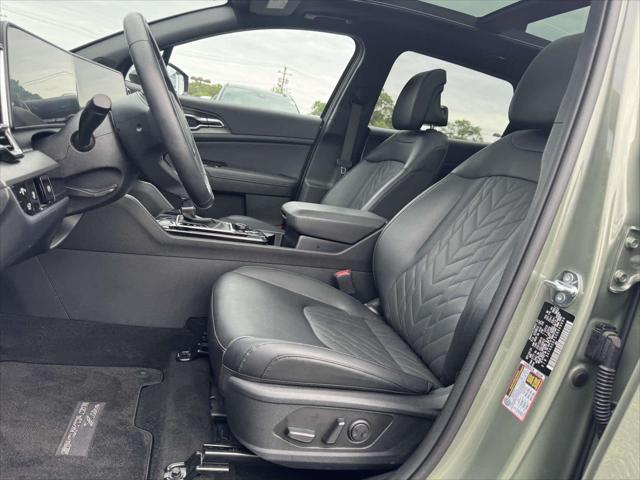 Photo of 2025 Jungle Green Kia Sportage