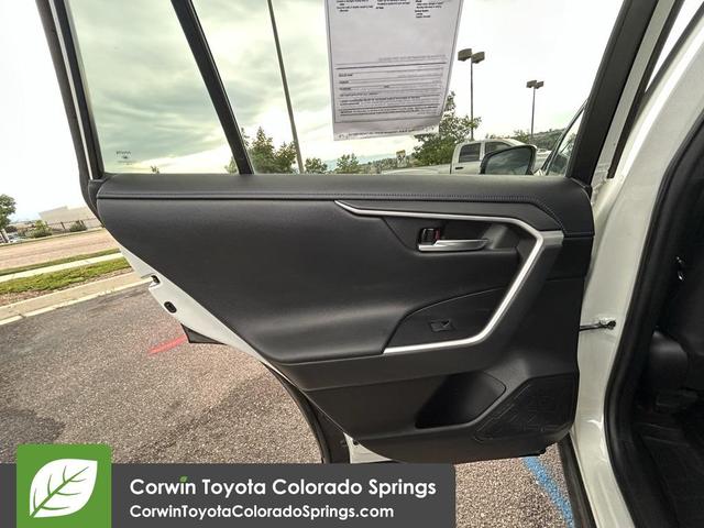 Photo of 2021 Blizzard Pearl/Midnight Black Metallic Toyota RAV4 Hybrid