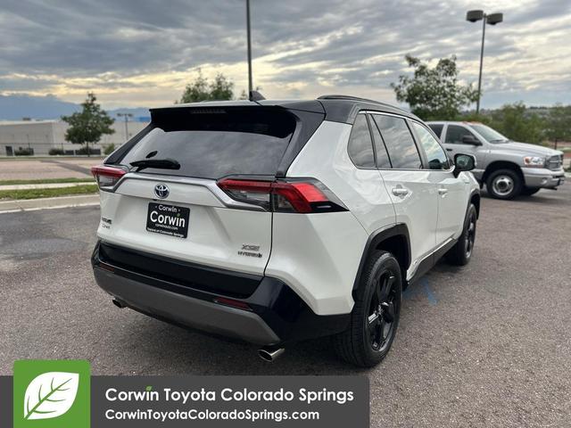 Photo of 2021 Blizzard Pearl/Midnight Black Metallic Toyota RAV4 Hybrid