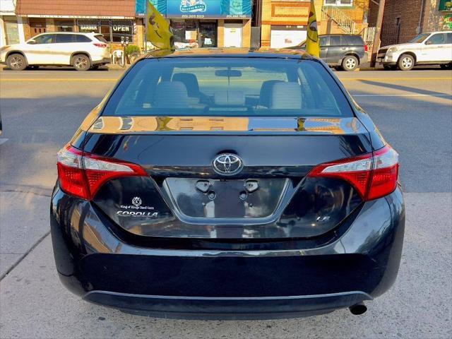 Photo of 2014 Black Sand Mica Toyota Corolla