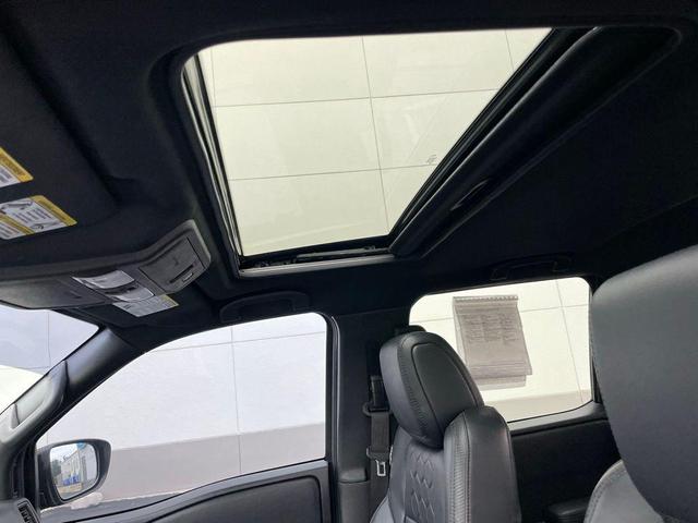 Photo of 2022 Tactical Green Metallic Nissan Frontier