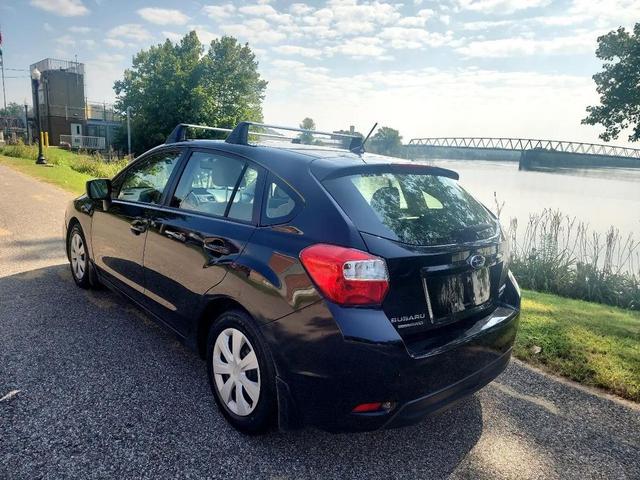 Photo of 2014 Crystal Black Silica Subaru Impreza