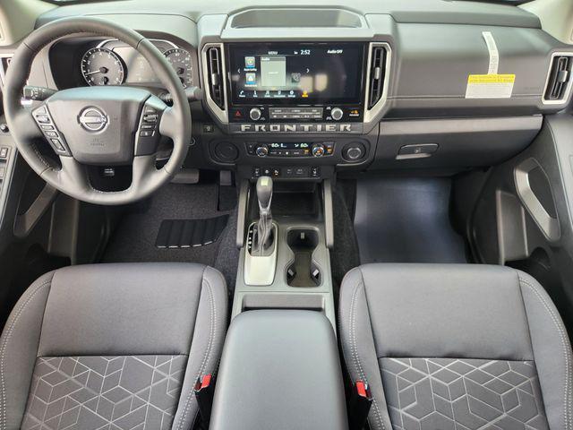 Photo of 2025 Glacier White Nissan Frontier
