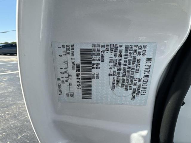 Photo of 2004 Vibrant White Lincoln Town Car
