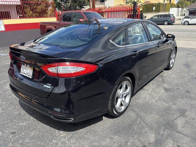 Photo of 2014 Tuxedo Black Metallic Ford Fusion