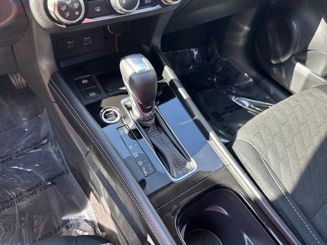 Photo of 2024 Aspen White Tricoat Nissan Kicks