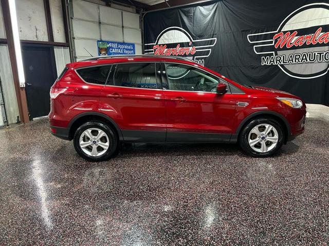 Photo of 2014 Ruby Red Tinted Clearcoat Ford Escape