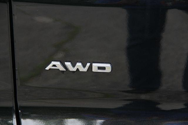 Photo of 2024 Stellar Black Metallic Cadillac XT4