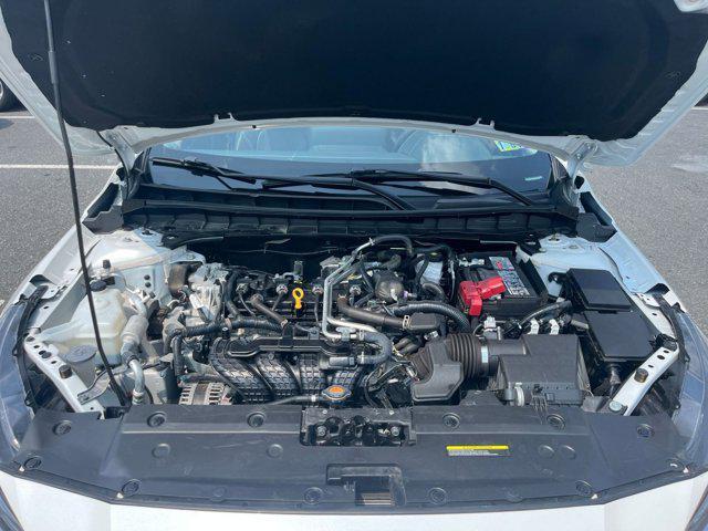 Photo of 2024 Pearl White Tricoat Nissan Altima