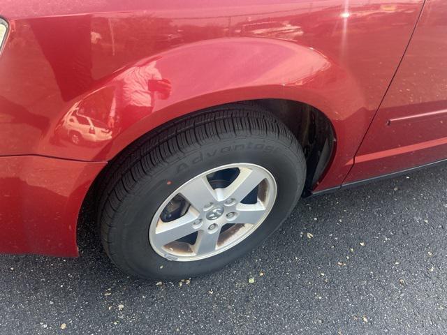 Photo of 2010 Inferno Red Crystal PC/Mineral Gray Met CC Dodge Grand Caravan