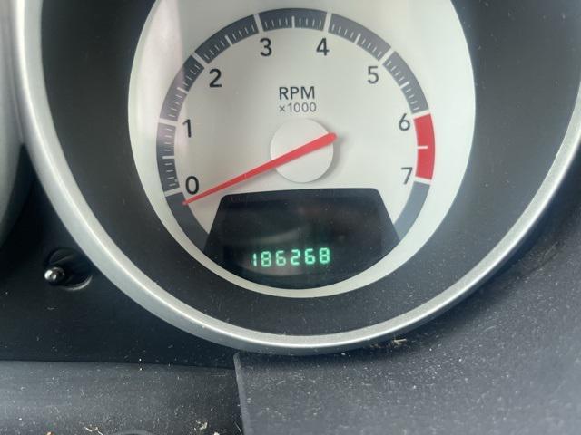 Photo of 2010 Inferno Red Crystal PC/Mineral Gray Met CC Dodge Grand Caravan