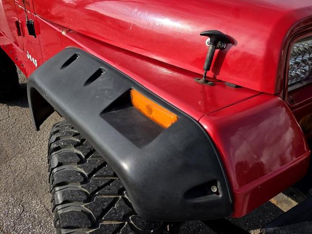 Photo of 1995 Red Jeep Wrangler