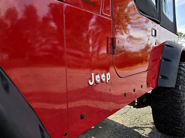Photo of 1995 Red Jeep Wrangler