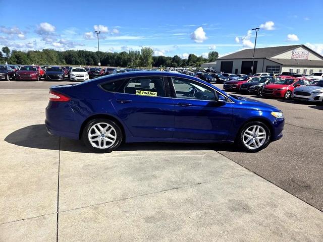 Photo of 2013 Deep Impact Blue Ford Fusion