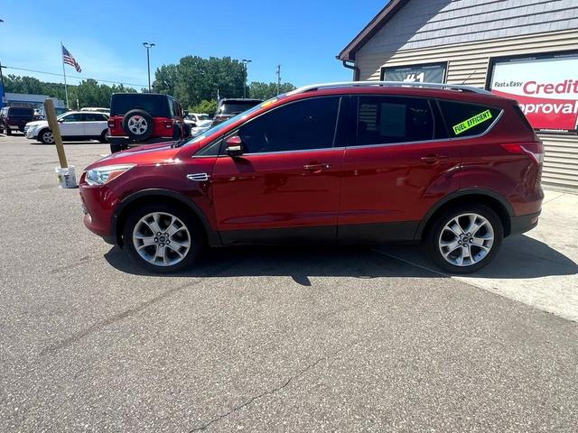 Photo of 2015 Ruby Red Metallic Tinted Clearcoat Ford Escape
