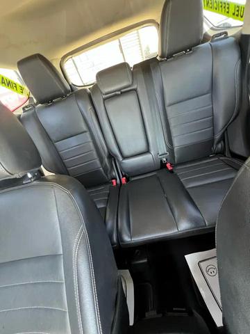 Photo of 2015 Ruby Red Metallic Tinted Clearcoat Ford Escape