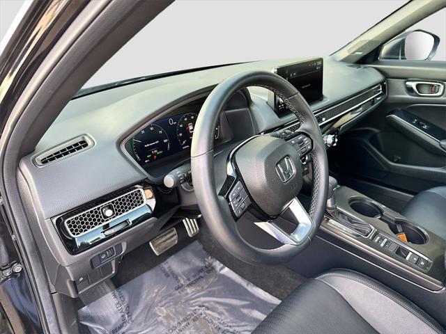 Photo of 2025 Crystal Black Pearl Honda Civic Hybrid
