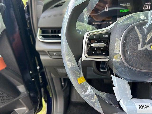 Photo of 2026 Deep Chroma Blue Kia Carnival Hybrid