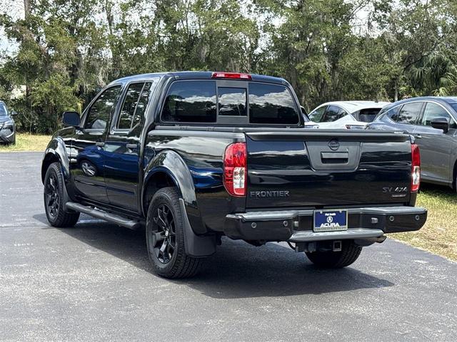 Photo of 2021 Magnetic Black Pearl Nissan Frontier