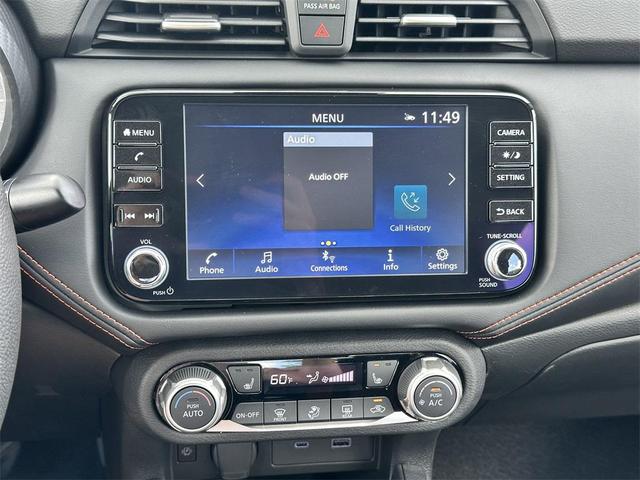 Photo of 2025 Aspen White Tricoat Nissan Versa