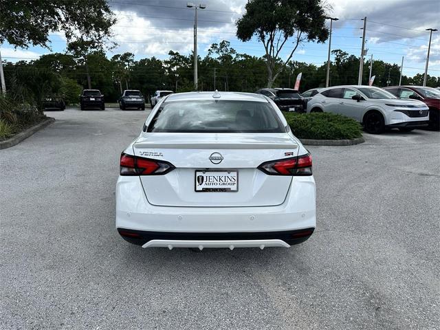 Photo of 2025 Aspen White Tricoat Nissan Versa