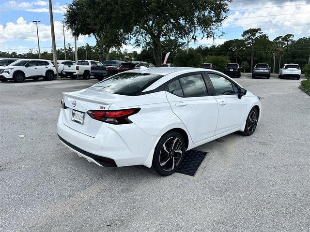 Photo of 2025 Aspen White Tricoat Nissan Versa