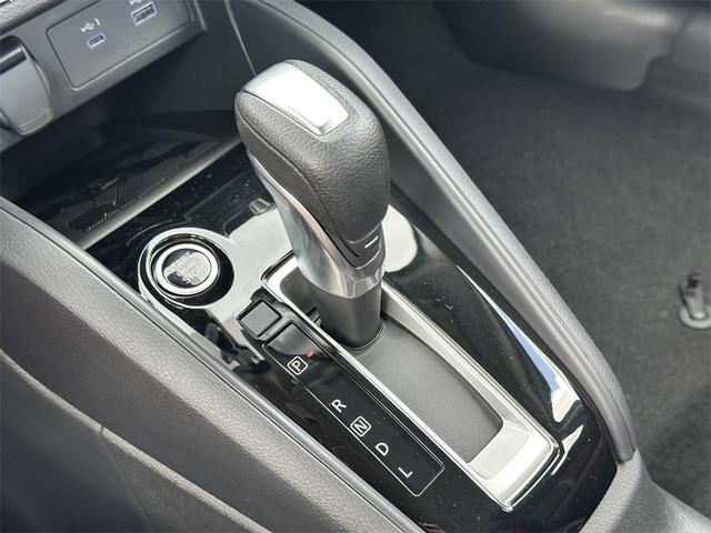 Photo of 2025 Aspen White Tricoat Nissan Versa