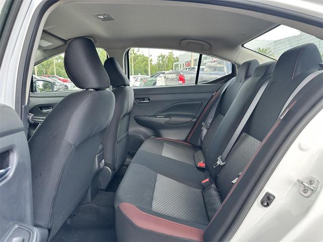 Photo of 2025 Aspen White Tricoat Nissan Versa