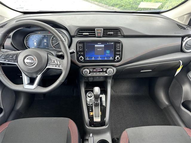 Photo of 2025 Aspen White Tricoat Nissan Versa