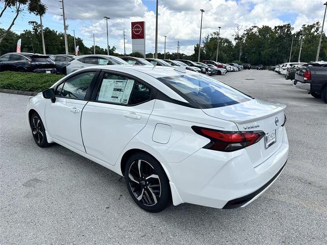 Photo of 2025 Aspen White Tricoat Nissan Versa