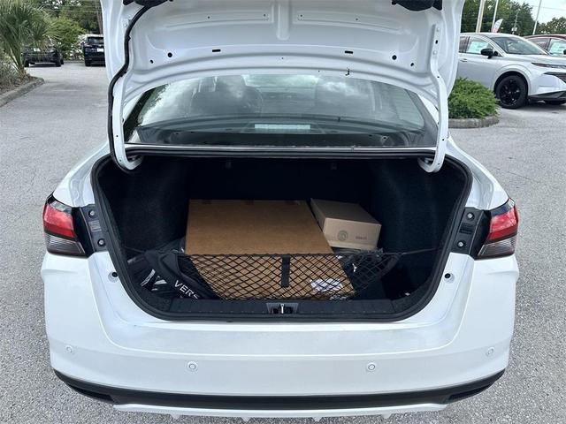Photo of 2025 Aspen White Tricoat Nissan Versa