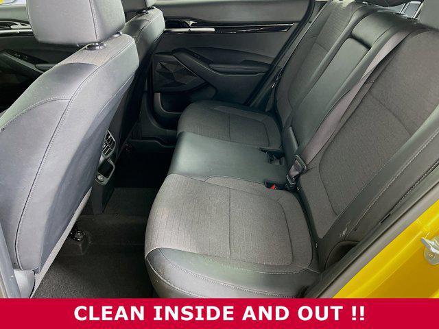 Photo of 2023 Starbright Yellow/Black Roof Kia Seltos