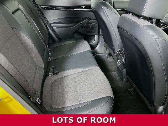 Photo of 2023 Starbright Yellow/Black Roof Kia Seltos