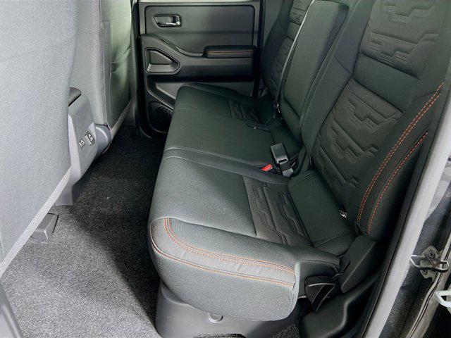 Photo of 2025 Super Black Nissan Frontier