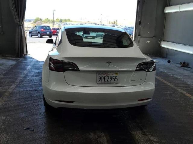 Photo of 2021 Pearl White Multi Tesla Model 3