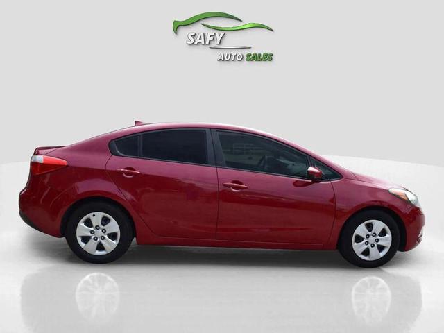 Photo of 2016 Crimson Red Metallic Kia Forte