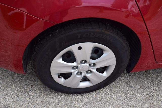 Photo of 2016 Crimson Red Metallic Kia Forte