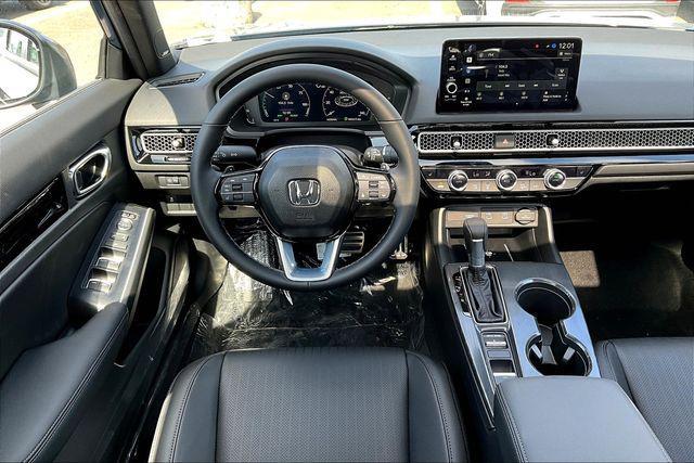 Photo of 2026 Blue Lagoon Honda Civic Hybrid