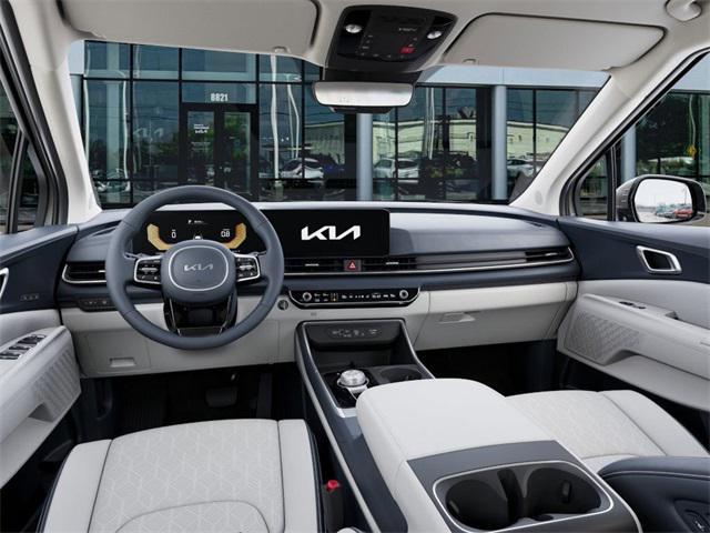 Photo of 2025 Ivory Silver Kia Carnival Hybrid