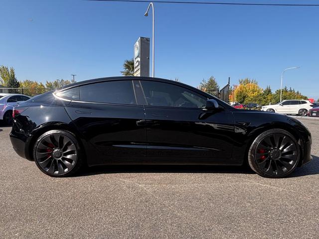 Photo of 2022 Black Tesla Model 3